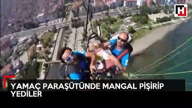 Yamaç paraşütü yapan iki genç havada mangal pişirip yedi