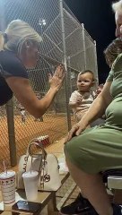 Baby Unsure How to High Five Woman With Missing Hand