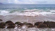 Waves crashing at Hamadi Beach in Jayapura city