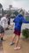 Group of Guys Try to Walk Against Strong Winds in South Carolina's Myrtle Beach Area