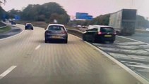 Shocking footage shows a driver cheat death after making a terrifying last-minute turn across a motorway