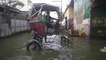 Motorbike taxis elevated to navigate flooding in the Philippines