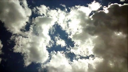 MCH 341  THE SKY IS THE LIMIT CLOUDS OF FLUFF LOOKING UP .
