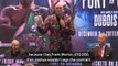 Fury parades £10,000 he won from Joshua fight bet