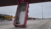 Dump truck box gets stuck vertically under Canadian overpass