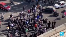 Iran protests: Police open fire as thousands mourn Mahsa Amini