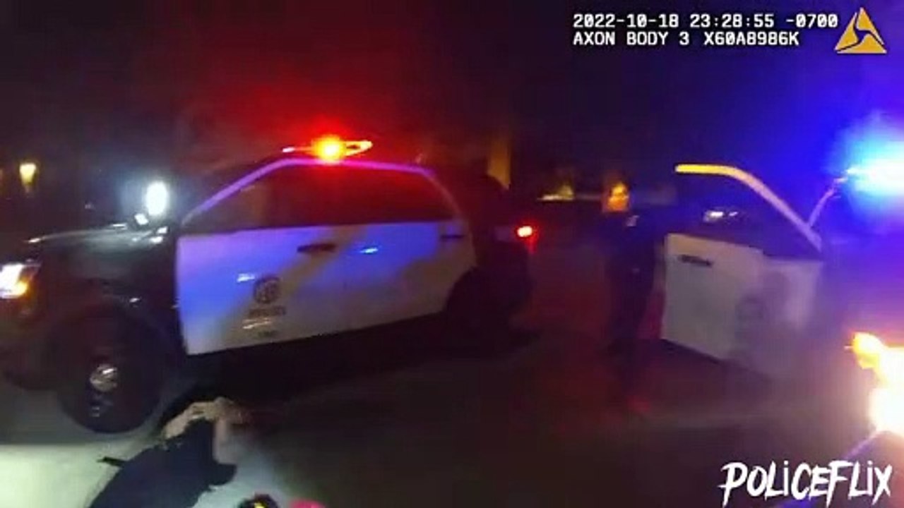 Lapd police provide first aid to injured victim after disarming suspect wielding samurai sword.