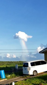 Rainbow Appears to Pour Out of Cloud