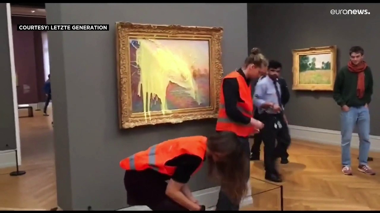 German climate activists throw mashed potatoes on painting