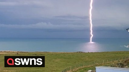 Rare footage shows moment lightning bolt slams into the sea off the English coast