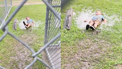 Young boy gives mom the 'shh' treatment and then lays in a puddle