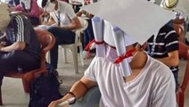 Filipinlerde kopya çekmeyi önleyen şapkalar bir tuhaf! Sosyal medya bu görüntüleri konuşuyor
