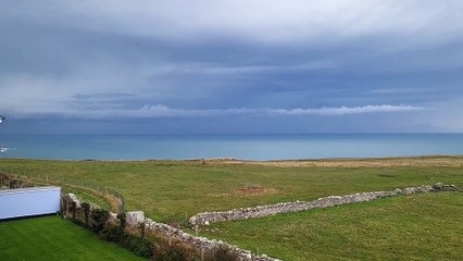 Rare footage shows the moment a lightning bolt slams into the sea off the English coast