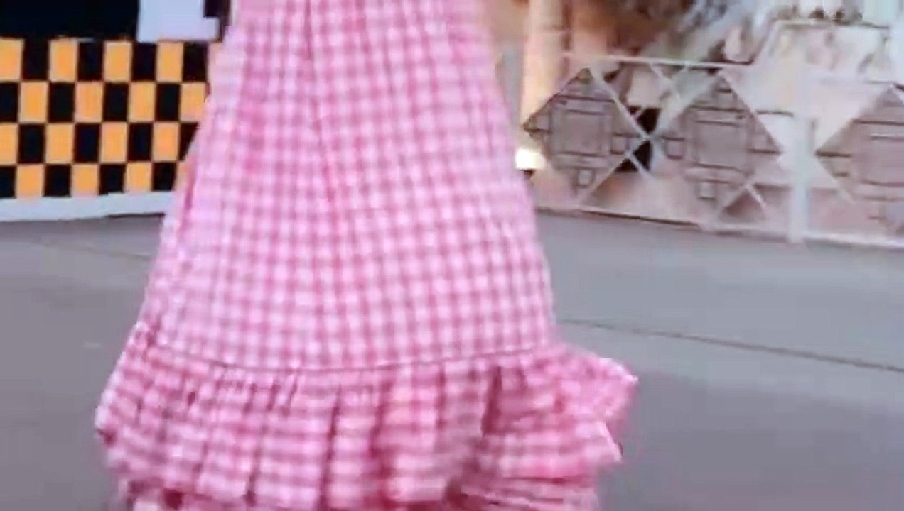 Mererid Rees walking on stilts at Global Village