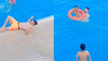 Man, chilling by the pool, HEROICALLY RUSHES to a drowning kid's rescue