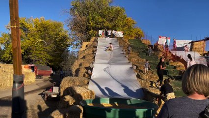 Kiddo Smooshed at the Bottom of the Slide