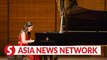 Chinese pianist delivers warmth and love through music