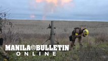 Ukrainian soldiers fire mortars in Kharkiv region