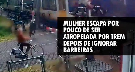 Mulher escapa por pouco de ser atropelada por trem depois de ignorar barreiras