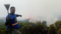 Firefighters battle wildfire on the slopes of Mount Kilimanjaro