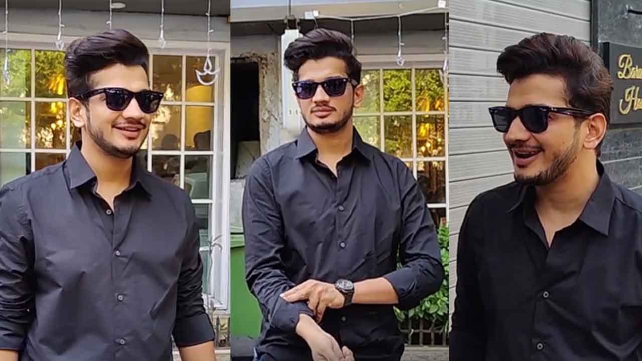 Munawar Faruqui's cute gesture as he distributes sweets to poor people and clicks selfies with them