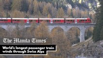 World's longest passenger train winds through Swiss Alps