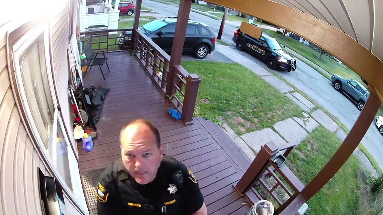 Sheriff's Deputy Acting Strange on Front Porch Caught by Security Camera