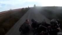 Moment armoured vehicle carrying fleeing Russian soldiers flips over on road