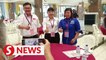 GE15: Candidates meet for a light moment at Tanjong nomination centre