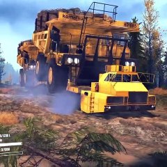 Big trucks tow Caterpillar trucks