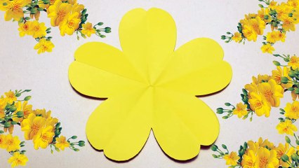 Instructions for folding a 5-petal yellow flower.