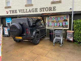 A Land Rover was still wedged in a shop doorway nearly three days after a suspected drink-drive collision