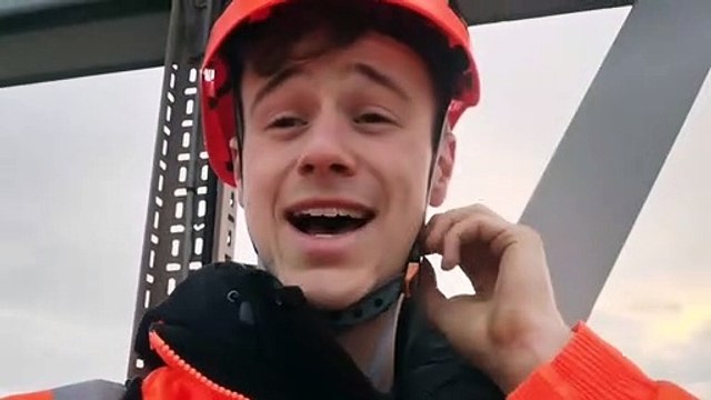 Sam Holland, 20, a Just Stop Oil protestor on the gantry at Junction 24. Credit: Just Stop Oil