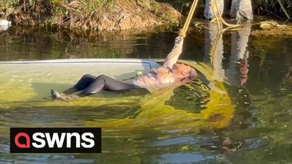 Florida paramotor pilot helps save woman clinging to submerged car that crashed into canal