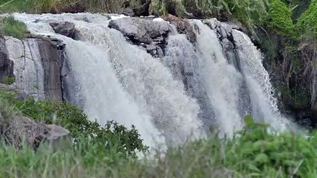 Air terjun mixkit-rocky-waterfall-on-a-river-in-nature-25542-medium