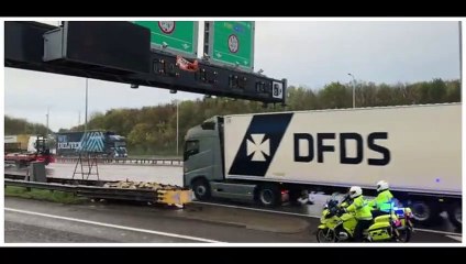 Eco-mob M25 stunt leaves police officer hit and lorries smashed up