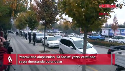 Yapraklarla oluşturulan '10 Kasım' yazısı etrafında saygı duruşunda bulundular