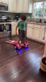 Kid Pulls Brother on Hoverboard