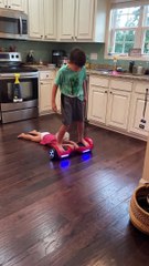 Kid Pulls Brother on Hoverboard