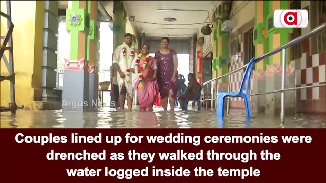Watch: Couples Lined Up For Wedding Drenched As They Walked Through Waterlogged Temple