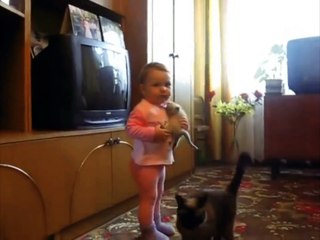 Mother cat takes the toddler's sobbing kitten.