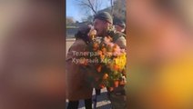 Elderly woman gifts Ukrainian soldiers flowers as forces return to Kherson