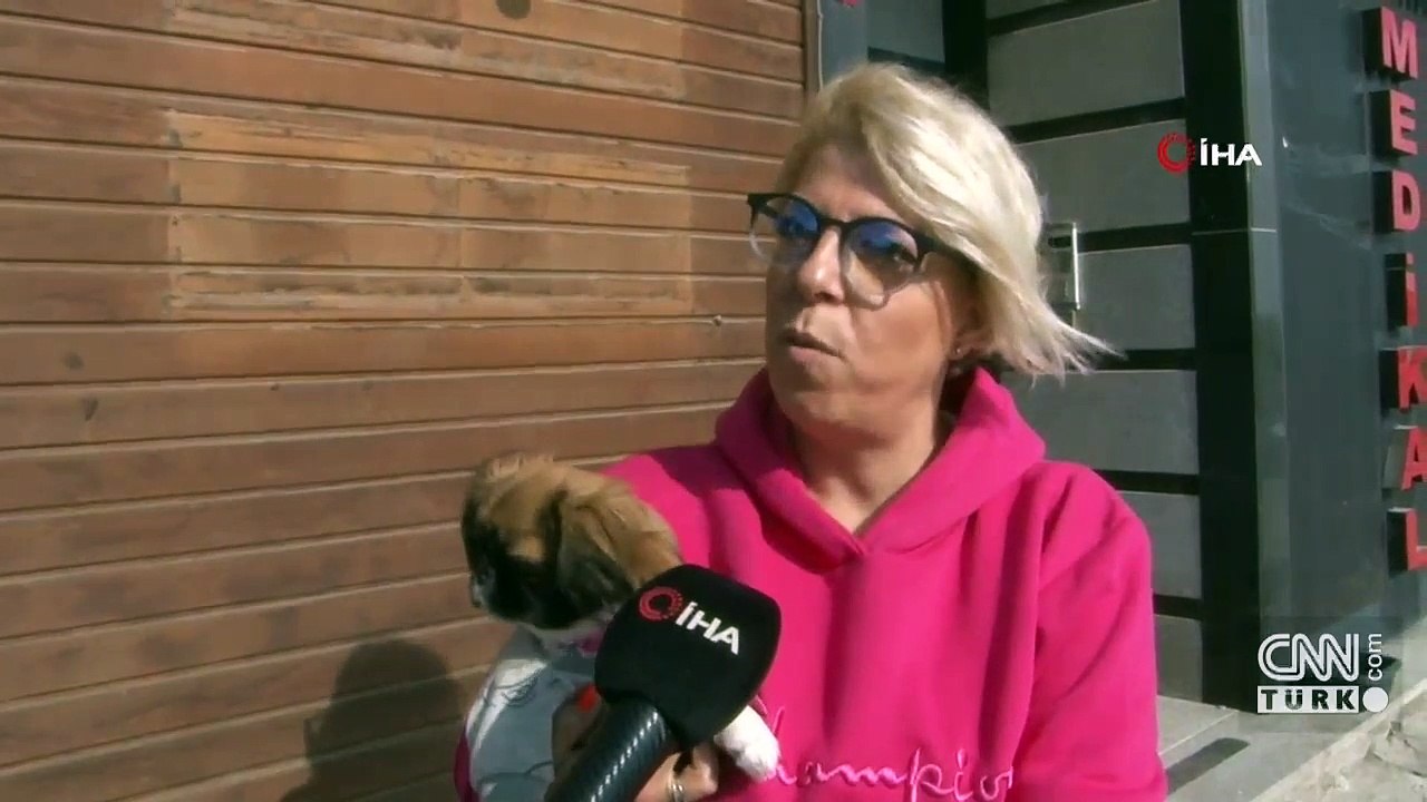 Pencereden düşen köpeğini havada yakaladı