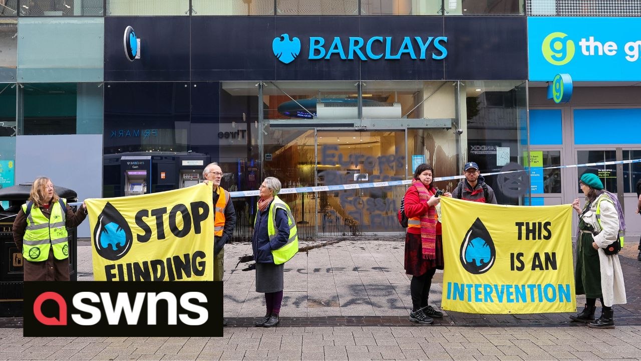 Climate activists smear Barclays windows with black paint in protest at bank's funding of fossil fuel industries