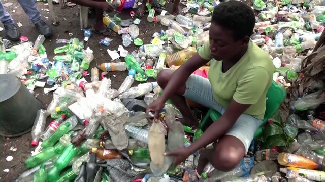 Nigerians trade waste material for health insurance