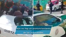 Policías son embestidos por un taxista en Iztapalapa; el conductor huyó