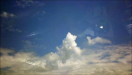 MCH 354 IMAGE OF WINDSHIELD FLUFFY WHITE CLOUDS OF HOT SUMMER DAYS DOG DAYS OF SUMMER .