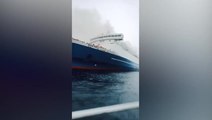 Smoke rises from ferry carrying 271 people after it catches fire off coast of Bali