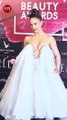 Elli AvrRam steals the show in a bold white gown at an award function in Mumbai