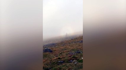 Walker captures the moment he spotted a "ghostly figure" hiking alongside him